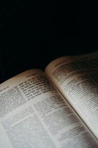 A close-up image of an open Torah book showcasing Hebrew text. Ideal for themes of tradition and religious study.